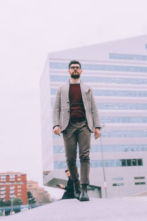 Photo for Young businessman bearded outdoor walking - Royalty Free Image