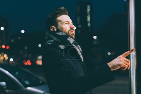 Photo for Young bearded business man touch screen - Royalty Free Image