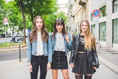Photo for Three young beautiful caucasian women millennials posing outdoor in the city, smiling - friendship, carefree concept - Royalty Free Image