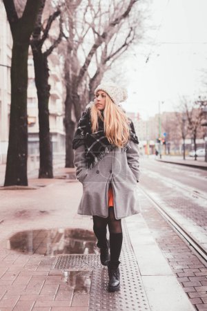 Photo for Young beautiful blonde woman outdoor walking in the street - strolling, day off, serene - Royalty Free Image
