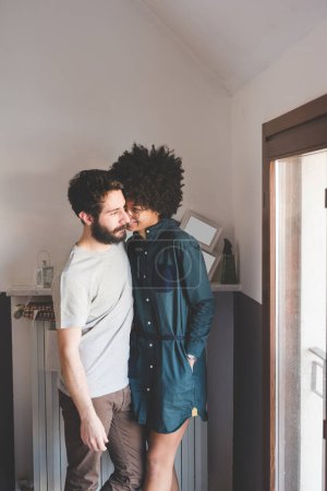 Photo for Young multiethnic couple posing smiling together at home - Royalty Free Image