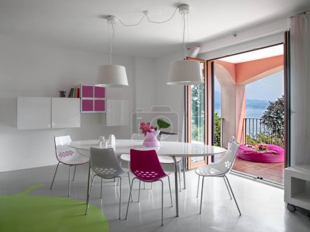 Téléchargez les photos : Interior view of a modern dining room overlooking on the terrace - en image libre de droit