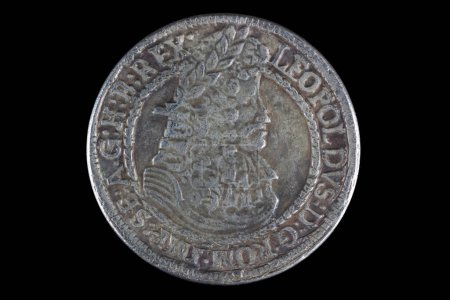 old vintage silver medieval taller coin on wooden background
