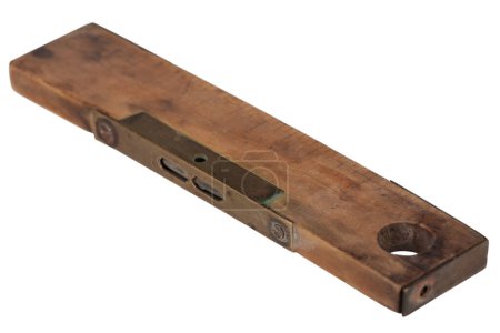 Antique carpenter's boxwood 8 inch ruler with spirit level from 19th century isolated on white background.