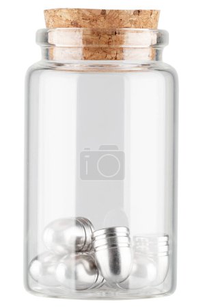 silver bullets for muzzle guns in apothecary glass jar on white background.