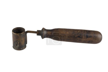 Antique black powder measure for loading cartridge. Isolated on a white background.