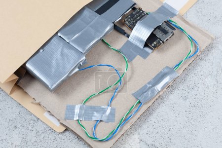 Mail bomb IED - Improvised Explosive Device with c4 and cell phone module in envelope