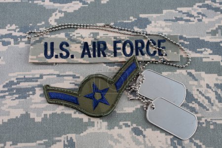US AIR FORCE branch tape and Airman rank patch and dog tags on digital tiger-stripe pattern Airman Battle Uniform (ABU)