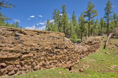 Photo for The crumbling remains of the Foxboro Lake Dam near Munds Park AZ. The dam was built in the 1920s but was abandoned during the 2nd world war. - Royalty Free Image