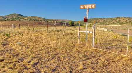 Half Horse Road, which branches off of Forest Service Road 70 at the border of Prescott National Forest and the town of Chino Valley Arizona. The fence marks the borderline of the national forest and the town. The sign that says Pitrat on the gate is