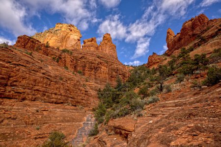 A view of Steamboat Rock on the right from its northeast flank. Just left of Steamboat is a rock formation referred to as the Captain and the Crew. Located in Sedona Arizona off of the Jim Thompson Trail.