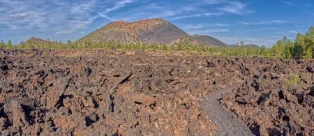Photo for Panorama of Sunset Crater Volcano from the Lava Edge Trail in the Bonito Lava Field west of the volcano. The Sunset Crater Volcano National Monument is located north of Flagstaff AZ. - Royalty Free Image