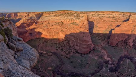 Wide angle photo of Mummy Cave in Tseh-Ya-Kin Canyon on the north end of Canyon De Chelly National Monument Arizona. The cave got its name from two mummies being found during an archaeology expedition in the late 1880s.