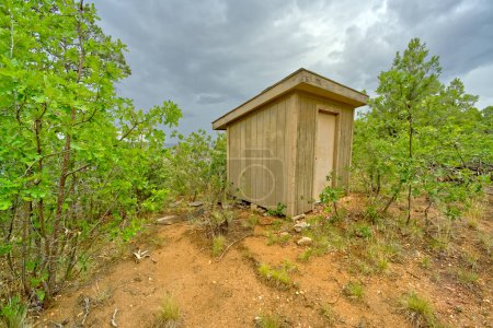 An old storage shed near the rim of Grand Canyon Arizona east of Grandview Point on a rainy day.