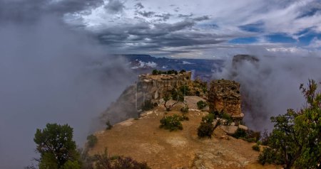 Moran Point at Grand Canyon South Rim Arizona with clouds rising up from below the cliffs.