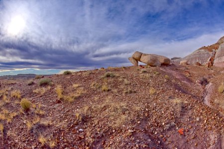 A pair of large boulders that have fallen in a way that looks like dominos at Petrified Forest National Park Arizona.