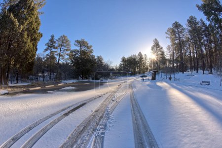 The Thumb Butte Recreation Area Parking Lot in the Prescott National Forest just west of Prescott Arizona, covered in winter snow and ice.