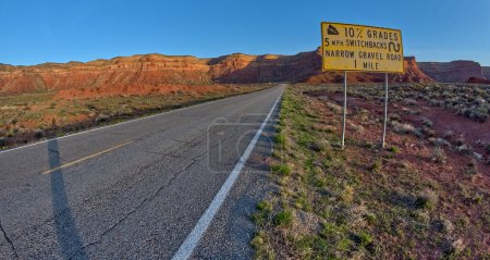 Sign warning of a steep grade ahead on Highway 261, also called the Moki Dugway, near Valley of the Gods Utah.