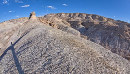 A solitary rock hoodoo in the purple badlands near Hamilili Point on the south end of Petrified Forest National Park Arizona.