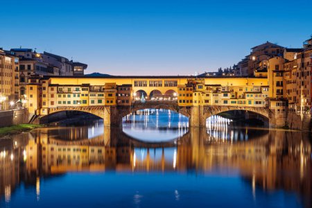 Photo for Florence, Italy at the Ponte Vecchio Bridge crossing the Arno River at twilight. - Royalty Free Image