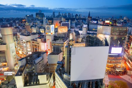 Foto de Tokyo, Japan cityscape the Shibuya District with a blank billboard offering ample copy space. - Imagen libre de derechos