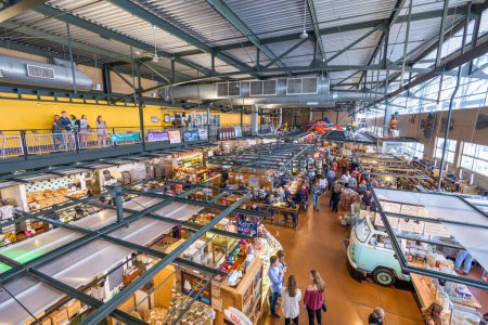 Photo for MILWAUKEE, WISCONSIN - MAY 19, 2018: Shoppers in the interior of Milwaukee Public Market. The market opened in 2005. - Royalty Free Image
