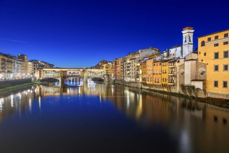 Photo for Florence, Italy at the Ponte Vecchio Bridge crossing the Arno River at twilight. - Royalty Free Image
