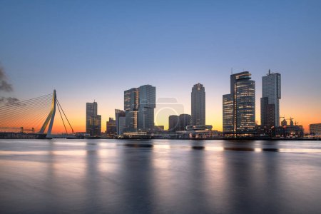 Photo for Rotterdam, Netherlands, city skyline on the river at twilight. - Royalty Free Image