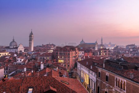 Foto de Venice; Italy rooftop skyline towards San Giorgio dei Greci and its leaning bell tower. - Imagen libre de derechos