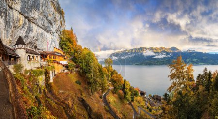 Photo for St. Beatus Caves Overlooking  Lake Thun, Switzerland at dusk in autumn. - Royalty Free Image