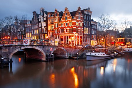 Photo for Amsterdam, Netherlands bridges and canals at twilight. - Royalty Free Image