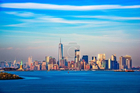 Photo for New York, New York, USA skyline of Manhattan from the harbor at dusk. - Royalty Free Image