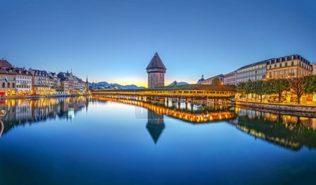 Photo for Lucerne, Switzerland with the Chapel Bridge and water tower over the River Reuss at dawn. - Royalty Free Image