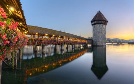 Lucerne, Switzerland on the Reuss River and the Chapel Bridge at dawn.