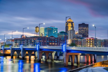 Des Moines, Iowa, USA downtown cityscape on the river at twilight.