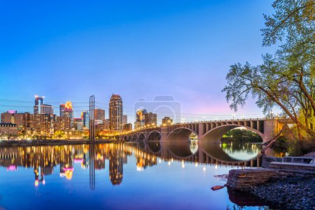 Minneapolis, Minnesota, USA downtown city skyline on the Mississippi at blue hour.