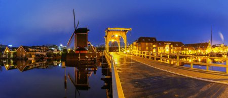Panorama of Leiden canal Galgewater with De Put windmill and Rembrandt Bridge, Netherlands