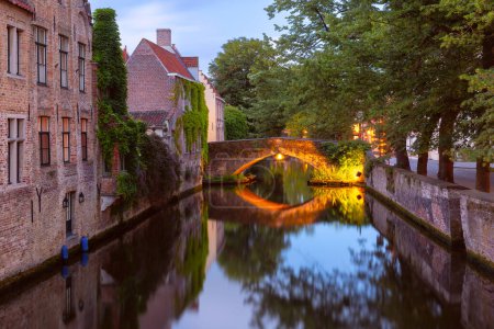 Scenic evening cityscape with medieval Green canal, Groenerei, in Bruges, Belgium