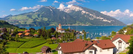 Panorama with Spiez Church and Castle on Lake Thun in Swiss canton of Bern, Spiez, Switzerland.