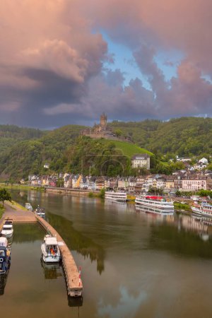 Cochem at sunrise, beautiful town on romantic Moselle river, Reichsburg castle on hill, Germany