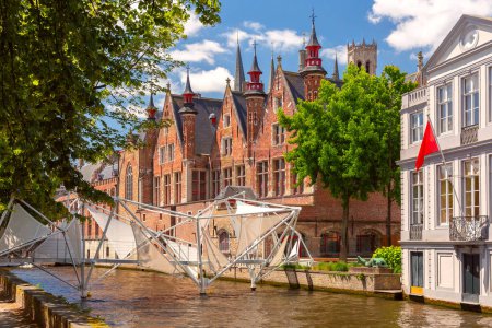Medieval tower Belfort and Green canal, Groenerei, in Bruges, Belgium