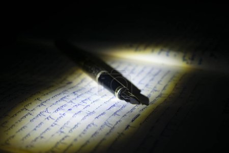 Photo for An old fountain pen resting on a manuscript - Royalty Free Image