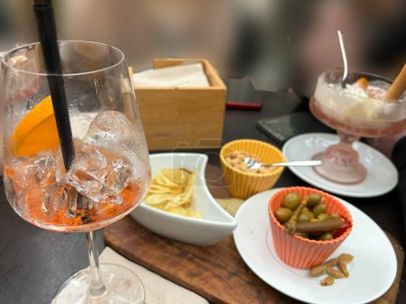 Photo for Freshly drunk cocktails with appetizers and olives - Royalty Free Image