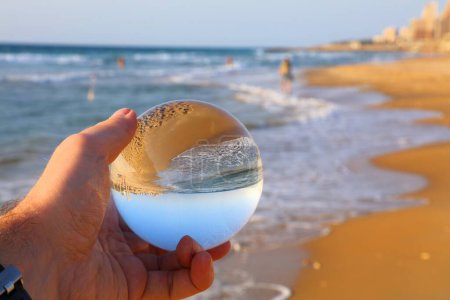 Beach vibes in Haifa, Israel. Glass ball reflection of Dado Beach in Haifa.
