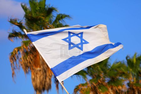Foto de Flag of Israel in the wind. Israeli national colors. - Imagen libre de derechos