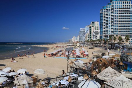 Photo for TEL AVIV, ISRAEL - NOVEMBER 2, 2022: People visit Aviv Beach in Tel Aviv, Israel. Tel Aviv is the economic and technological center of Israel. - Royalty Free Image
