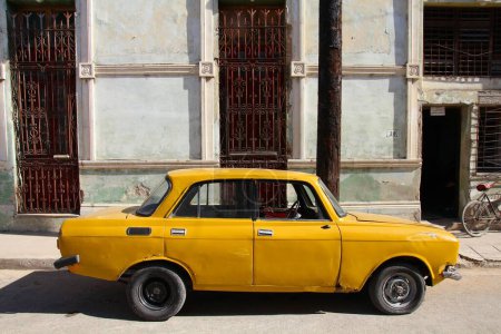 Photo for CAMAGUEY, CUBA - FEBRUARY 17, 2011: Oldtimer Moskvich 1500 car parked in Camaguey, Cuba. Cuba has one of the lowest car-per-capita rates with multitude of old Soviet cars. - Royalty Free Image