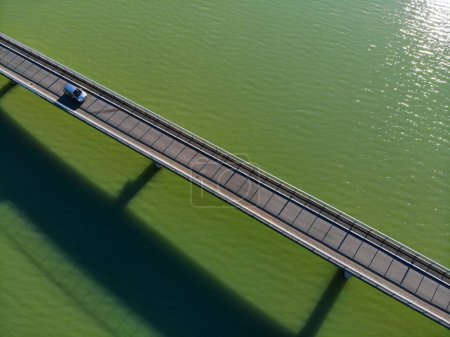 Photo for Austria drone view. Narrow road bridge over reservoir Annabrucke on River Drau. Infrastructure of Carinthia. - Royalty Free Image