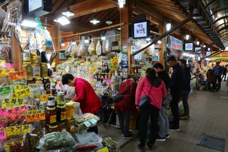 Photo for HWAGAE-MYEON, SOUTH KOREA - APRIL 3, 2023: People visit Hadong Hwagae Market in Hwagae. The market is known for Korean herbal medicine products from Jirisan Mountain area. - Royalty Free Image