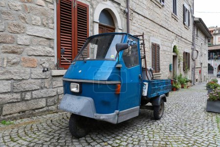 Photo for AGGIUS, ITALY - MAY 24, 2023: Bizarre Piaggio tricycle mini trucks typical for Italy parked in Aggius town in Sardinia island. - Royalty Free Image